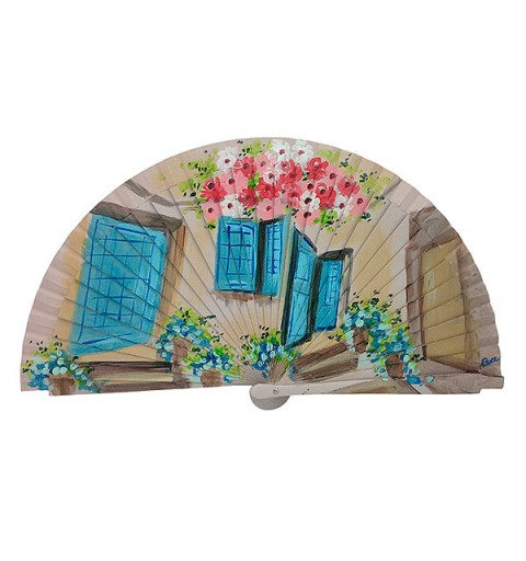 Handmade fan facade with flowers and blue windows