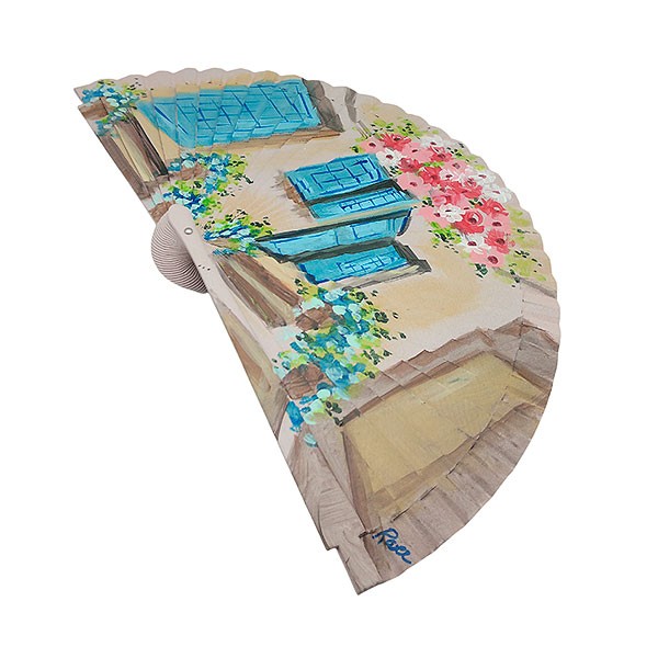 Handmade fan facade with flowers and blue windows