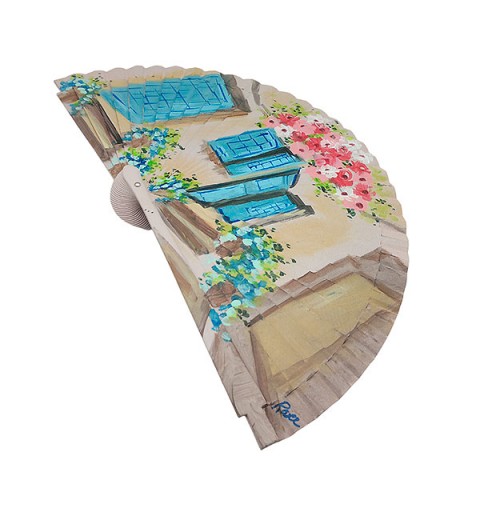 Handmade fan facade with flowers and blue windows
