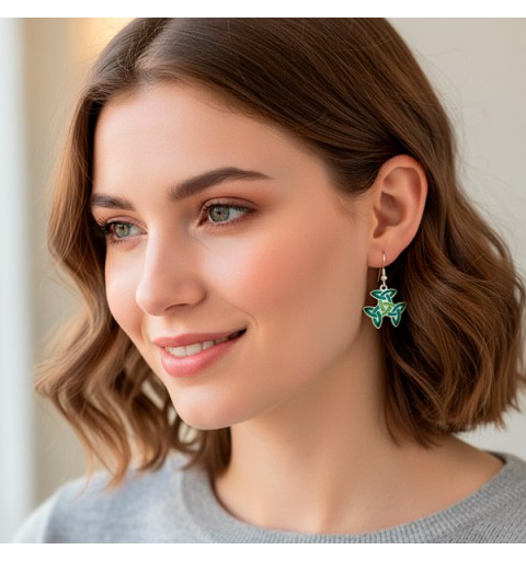 Earrings with a Celtic symbol, called the trinity knot or triple triquetra
