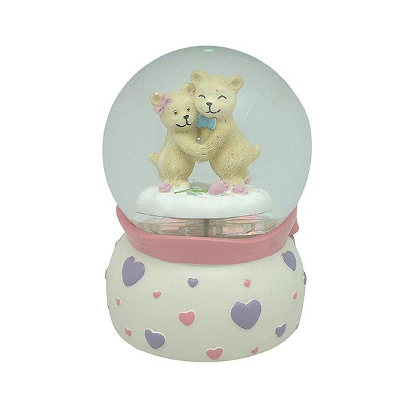 Snow globe with teddy bears, features music and movement