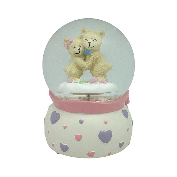 Snow globe with teddy bears, features music and movement
