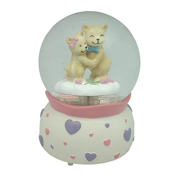 Snow globe with teddy bears, features music and movement
