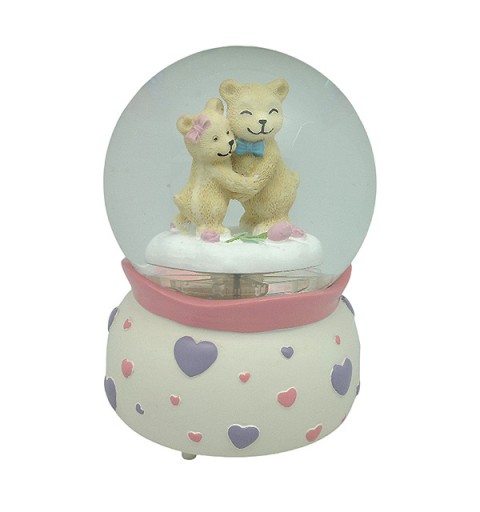 Snow globe with teddy bears, features music and movement
