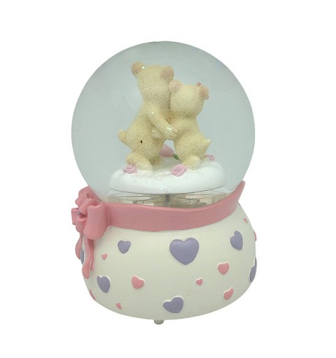 Snow globe with teddy bears, features music and movement