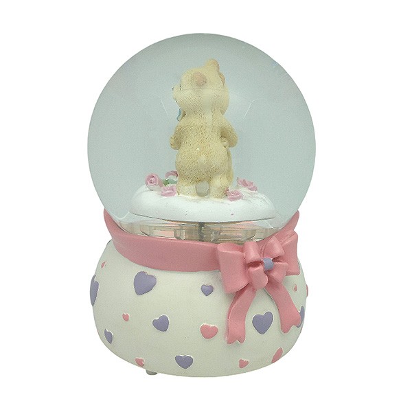 Snow globe with teddy bears, features music and movement