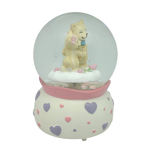Snow globe with teddy bears, features music and movement