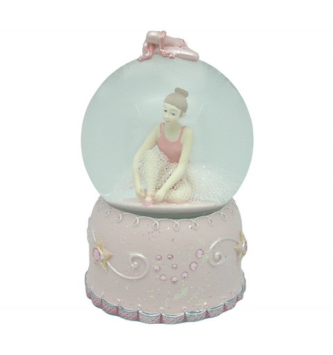 Bola de nieve, en la que podemos ver a una bailarina, ajustando sus zapatillas de punta.