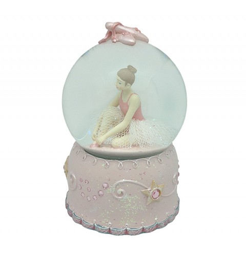 Snow globe, in which we can see a ballerina adjusting her pointe shoes.