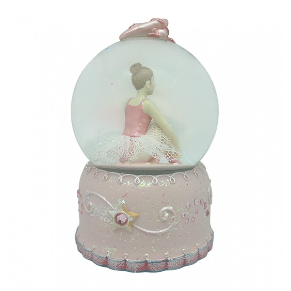Snow globe, in which we can see a ballerina adjusting her pointe shoes.